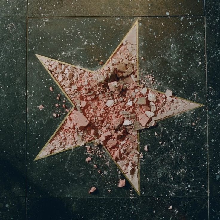 A broken Hollywood Walk of Fame star, a visual reference for Coming Soon